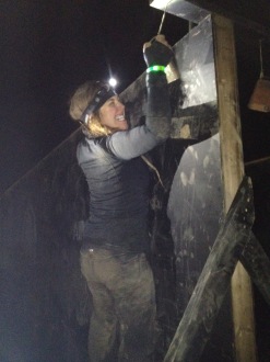 Aurora holding on to a wall, ringing a bell at night during the Spartan Ohio trifecta-in-a-day 2014
