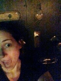 Aurora giving an excited face in front of the doorknobs at Lock and Key in Los Angeles