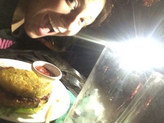 Aurora posing with her veggie ramen burger at Lock and Key