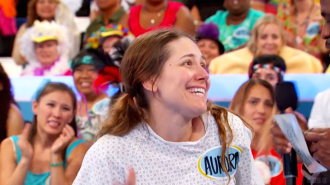 Aurora De Lucia smiling and looking a little confused on Let's Make a Deal