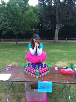 Aurora De Lucia standing at the Happy Hair Station with the girls on the run 5k