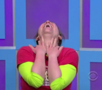 Aurora ecstatic on floor with head up on The Price is Right