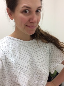 Aurora giving a face in a hospital gown
