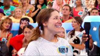 Aurora looking up and smiling on Let's Make a Deal