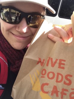 Aurora De Lucia holding a Native Foods Cafe bag