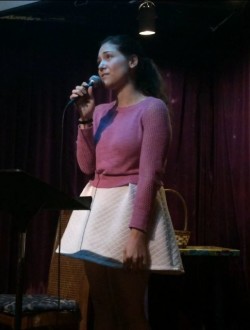 Aurora looking disappointed during her poem at Unurban Cafe