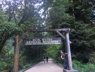 Aurora posing at the Muir Woods sign