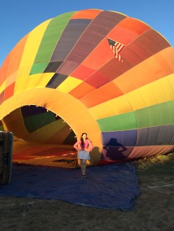Aurora standing in front of hot air balloon opening (2nd shot)
