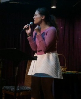Aurora De Lucia with frustrated look at open mic poetry