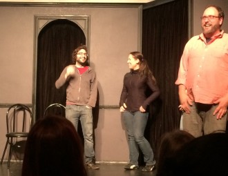 Aurora with the other improv guest laughing at the beginning of their show with The Deltones at iO West