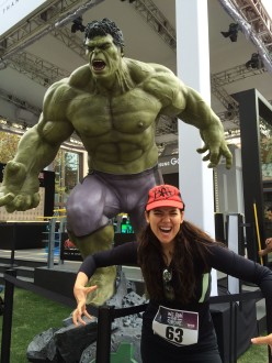 Aurora De Lucia posing with The Hulk statue before The Grove half marathon