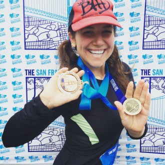 Aurora with her medals after the finish of the San Francisco 1st half marathon