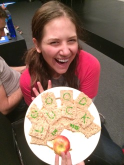 Aurora holding her special goodbye snack at Groundlings