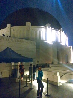 Aurora standing outside the Griffith Observatory dome