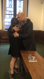 Aurora and Cory Booker hugging