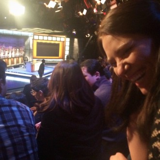 Aurora De Lucia laughing at a taping of Last Week Tonight