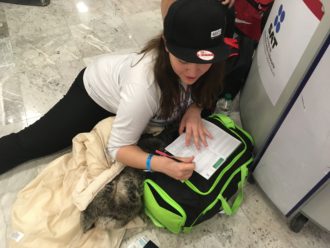 Aurora filling out her custom forms at the Mexico City airport